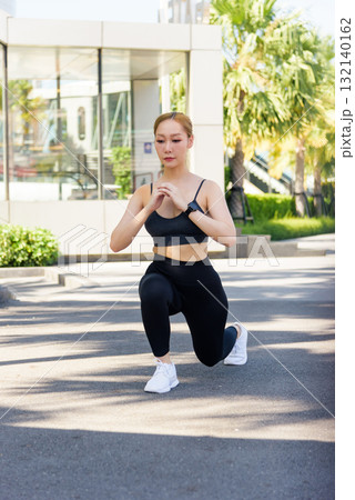 Fit woman performing sport exercise workout lunge outdoor, people enjoying active lifestyle, engaging in healthy physical exercise routine for body strength. 132140162