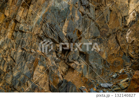 Dramatic rock formation in mountainous outdoor setting 132140827