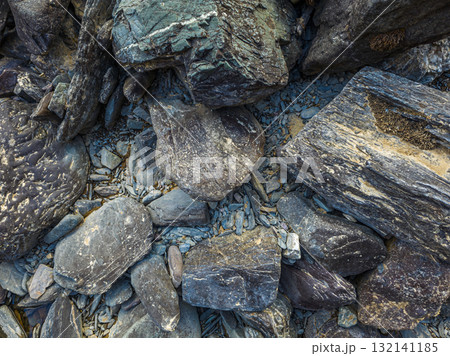Various rocks on rugged ground in natural outdoor setting, high angle view 132141185
