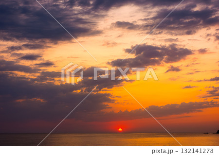 dramatic sky at sunrise at the sea. wonderful atmospheric background for wallpaper. stormy clouds above the water. sun over horizon. nature landscape of sozopol bay in summer. warm colorful gradient dramatic sky at sunrise at the sea. wonderful atmospheric background for wallpaper. stormy clouds above the water. sun over horizon. nature landscape of sozopol bay in summer. warm colorful gradient 132141278