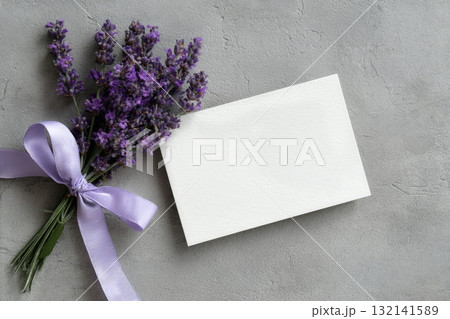 Small Lavender Bouquet With Blank Card on a Textured Gray Surface for Notes or Messages Small Lavender Bouquet With Blank Card on a Textured Gray Surface for Notes or Messages 132141589