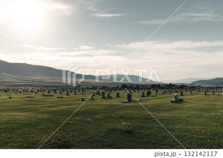 Cemetery Landscape With Headstones Under a Clear Sky and Mountains in the Background During Daylight Cemetery Landscape With Headstones Under a Clear Sky and Mountains in the Background During Daylight 132142117
