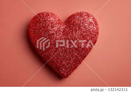 Bright Red Glitter Heart on a Soft Pink Background for Festive Occasions 132142311