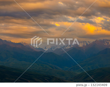 Majestic sunset over snow-capped mountain range and valleys Majestic sunset over snow-capped mountain range and valleys 132143409