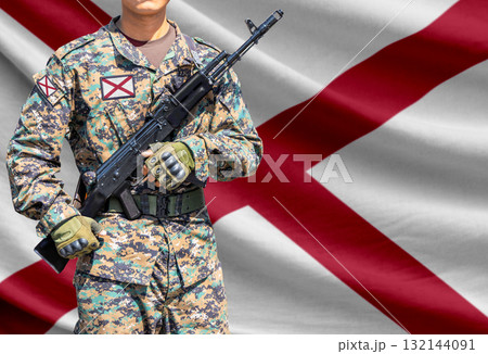 Alabama US state flag with soldier holding assault rifle 132144091