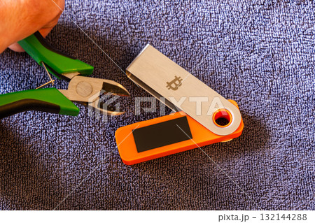 hardware wallet near wire cutters indoors 132144288
