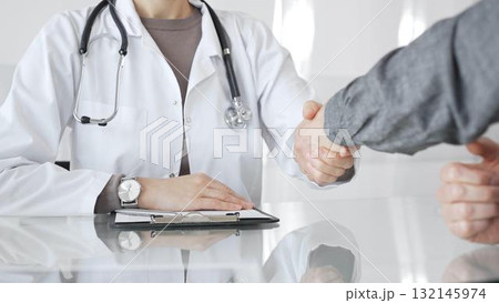 Doctor and patient hands shaking, symbolizing trust, agreement, healthcare partnership, successful consultation, and medical service. Medicine and health care Doctor and patient hands shaking, symbolizing trust, agreement, healthcare partnership, successful consultation, and medical service. Medicine and health care 132145974