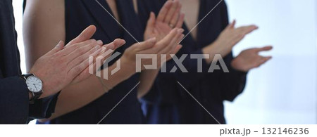 Business people applauding, showing appreciation and celebrating success during a corporate event, conference, or team meeting in an office environment Business people applauding, showing appreciation and celebrating success during a corporate event, conference, or team meeting in an office environment 132146236