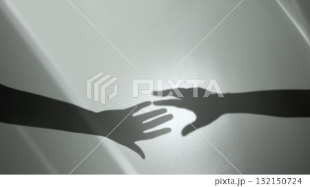 Shadow of Two Hands trying to Reaching each others. Helping Hand. Support, Partnership 132150724