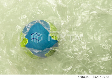 Sadness Globe wraped by Plastic materials. Environmental Issue Concept 132150728