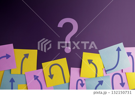 Economic uncertainty symbolized by arrows and a question mark 132150731
