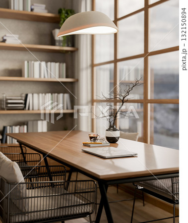 A wooden square table and armchairs next to a glass wall under lamp light in library or study room. 132150894