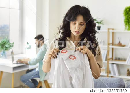 Woman discovers lipstick on partners shirt, sparking argument and trust issues Woman discovers lipstick on partners shirt, sparking argument and trust issues 132151520