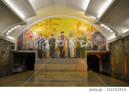 A Pyongyang subway station with a colourful mural depicting North Korean workers 132152914