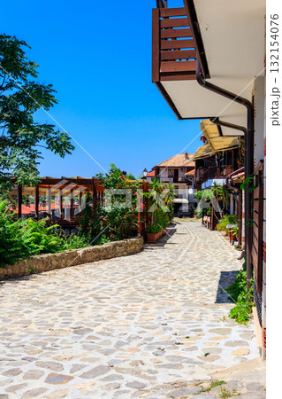 Narrow street of the old town of Nessebar in Bulgaria 132154076