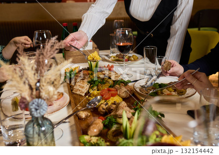 Cheers to a Fantastic Celebration Friends Joyfully Toasting with Wine Glasses in Hand Cheers to a Fantastic Celebration Friends Joyfully Toasting with Wine Glasses in Hand 132154442