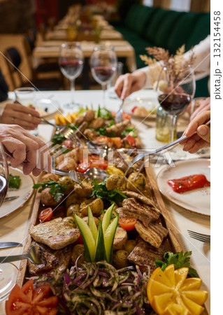 An Elegant Dining Experience Featuring a Lavish Feast of a Wide Variety of Dishes An Elegant Dining Experience Featuring a Lavish Feast of a Wide Variety of Dishes 132154458