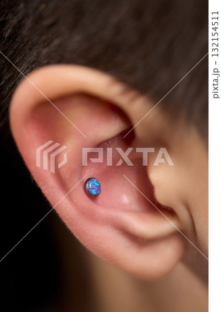 Professional Piercing Process A detailed closeup view showcasing the art of Ear Piercing 132154511