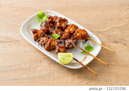grilled chicken gizzard skewer with herbs and spices 132155298