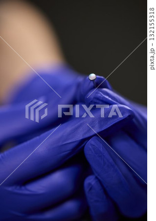 Professional Piercing Process A detailed closeup view showcasing the art of Ear Piercing 132155318