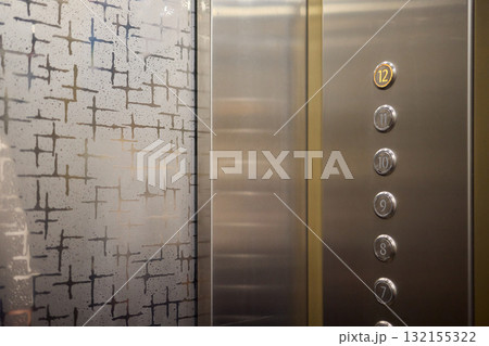 The modern elevator control panel features a display showcasing the current floor number The modern elevator control panel features a display showcasing the current floor number 132155322