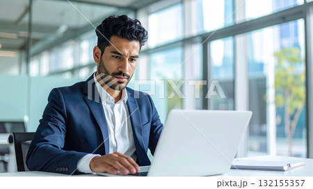 オフィスでノートパソコンで真剣に仕事をする若い外国人男性 16:9サイズ AI生成素材 オフィスでノートパソコンで真剣に仕事をする若い外国人男性 16:9サイズ AI生成素材 132155357