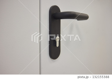 Sleek and Modern Door Handle Featuring an Innovative Locking Mechanism for Enhanced Security 132155388