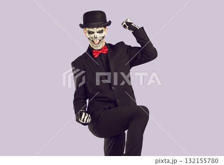 Scary excited man with skeleton makeup celebrating success 132155780