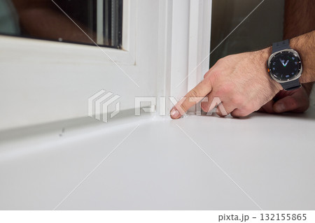 A thorough inspection of the window corner highlights craftsmanship and care with focus 132155865