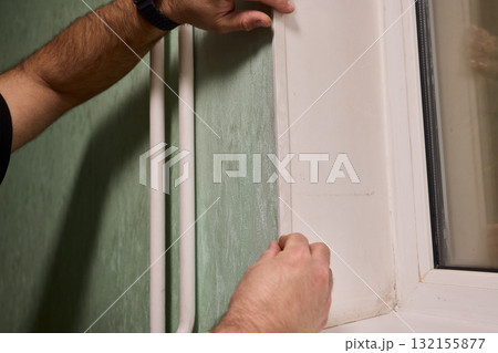 Applying Caulk to Wall Trim in Order to Achieve a Neat and Clean Finish for Your Home Applying Caulk to Wall Trim in Order to Achieve a Neat and Clean Finish for Your Home 132155877
