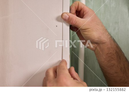 Applying Caulk to Wall Trim in Order to Achieve a Neat and Clean Finish for Your Home Applying Caulk to Wall Trim in Order to Achieve a Neat and Clean Finish for Your Home 132155882