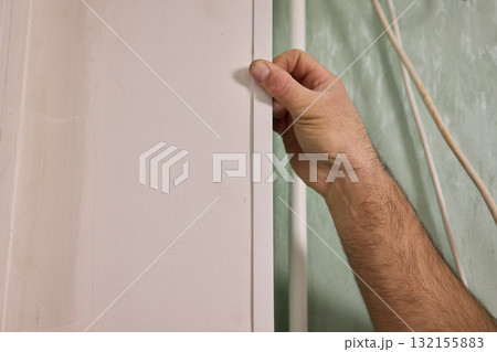 Applying Caulk to Wall Trim in Order to Achieve a Neat and Clean Finish for Your Home Applying Caulk to Wall Trim in Order to Achieve a Neat and Clean Finish for Your Home 132155883