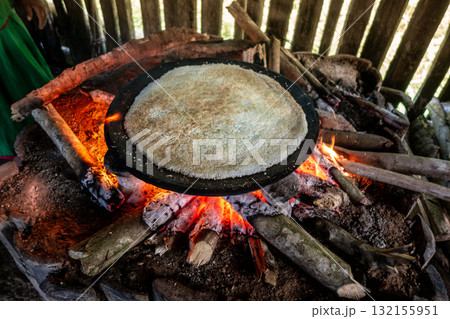 Cooking Cassava Cake in Siona Village, Cuyabeno, amazonia, Ecuador Cooking Cassava Cake in Siona Village, Cuyabeno, amazonia, Ecuador 132155951