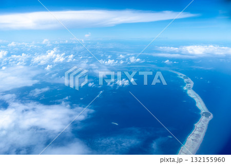 Aerial view of the Tuamotus atoll in French Polynesia with clouds Aerial view of the Tuamotus atoll in French Polynesia with clouds 132155960
