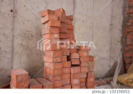 A closeup image of Stacked Red Bricks showcased in a dynamic Construction Environment A closeup image of Stacked Red Bricks showcased in a dynamic Construction Environment 132156052