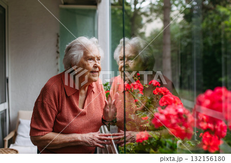 Cute old lady on balcony. Cute old lady on balcony. 132156180