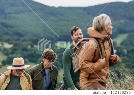 Multigenerational family on hiking trip in nature. 132156259
