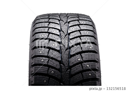 Winter studded tire details close-up. Front view, isolate on a white background. A mock-up for the sale of winter tires with seasonal design changes 132156518