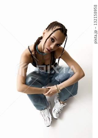 beautiful girl with braids. pretty young woman with tressed hairstyle beautiful girl with braids. pretty young woman with tressed hairstyle 132158958