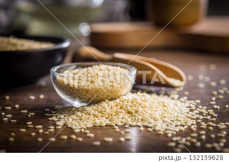 Roasted sesame seeds in bowl on wooden table. Roasted sesame seeds in bowl on wooden table. 132159628