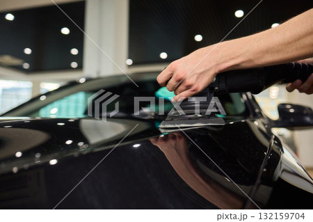 Applying a Protective Film on the Surface of Your Car for Enhanced Durability and Shine Applying a Protective Film on the Surface of Your Car for Enhanced Durability and Shine 132159704