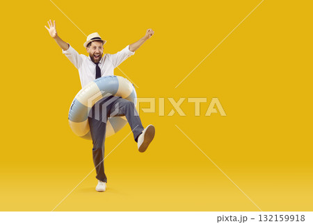 Happy, joyful, excited male office worker having fun on summer holiday at the beach 132159918