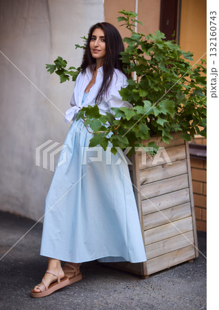 Elegant Outdoor Fashion A Stylish Woman Looking Fabulous in a Casual Yet Chic Look 132160743