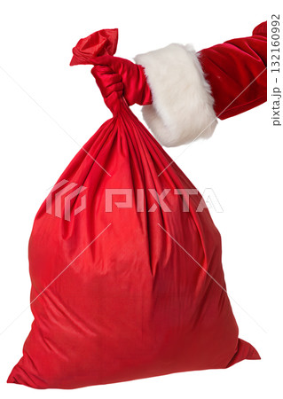 Santa claus's hand holding overflowing red gift sack with presents, magical christmas eve delivery concept isolated Santa claus's hand holding overflowing red gift sack with presents, magical christmas eve delivery concept isolated 132160992