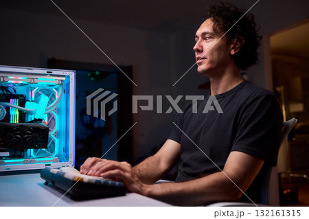 A Close Up View of Hands Actively Typing on a Vibrant and Colorful Mechanical Keyboard 132161315