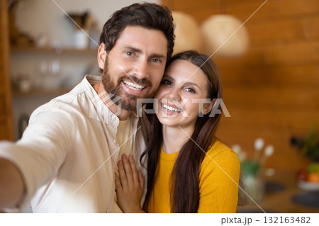 Smiling man and woman feeling excited and joyful together Smiling man and woman feeling excited and joyful together 132163482