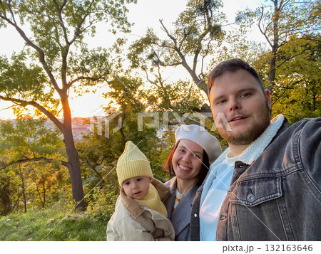Family portrait at sunset in nature Family portrait at sunset in nature 132163646