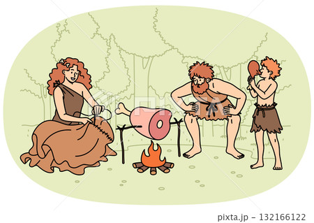 Family primitive people stands around fire in forest, roasting meat for dinner or sewing up clothes 132166122