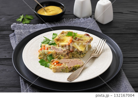 Cheesy ground meat vegetables casserole on a plate 132167004