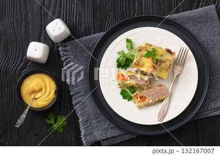 Cheesy ground meat vegetables casserole on a plate 132167007